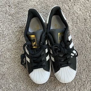 Gently used (worn once) black and white with snack skin detailing Adidas